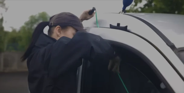 Mobile locksmith performing an emergency car lockout in Tuscaloosa